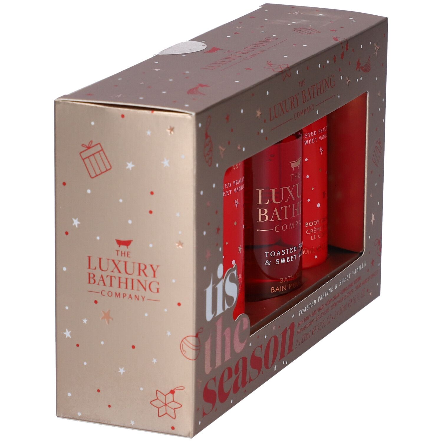 Confezione regalo dorata con tre prodotti rossi. Scritta "tis the season". Vista angolata.