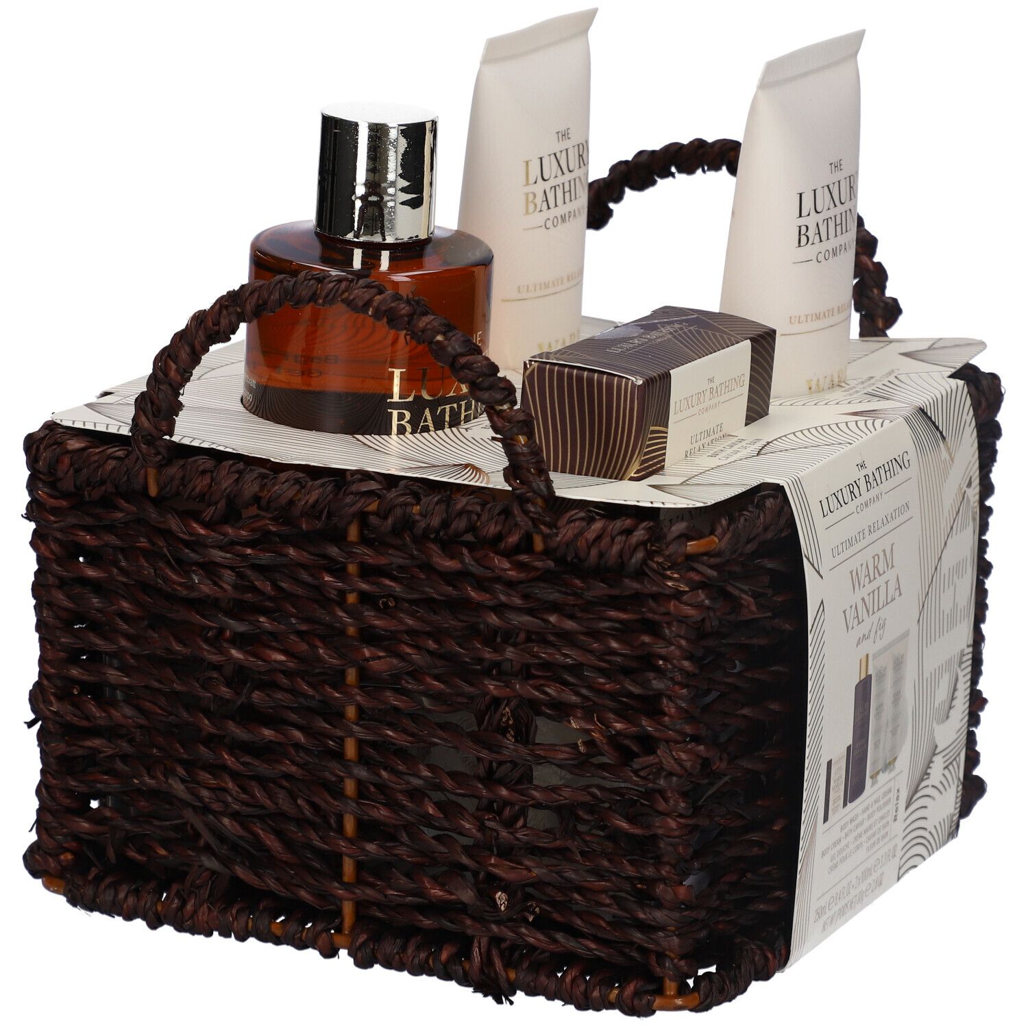 Set regalo in un cesto marrone. Contiene gel doccia, crema mani, crema corpo, perle da bagno e profumo.