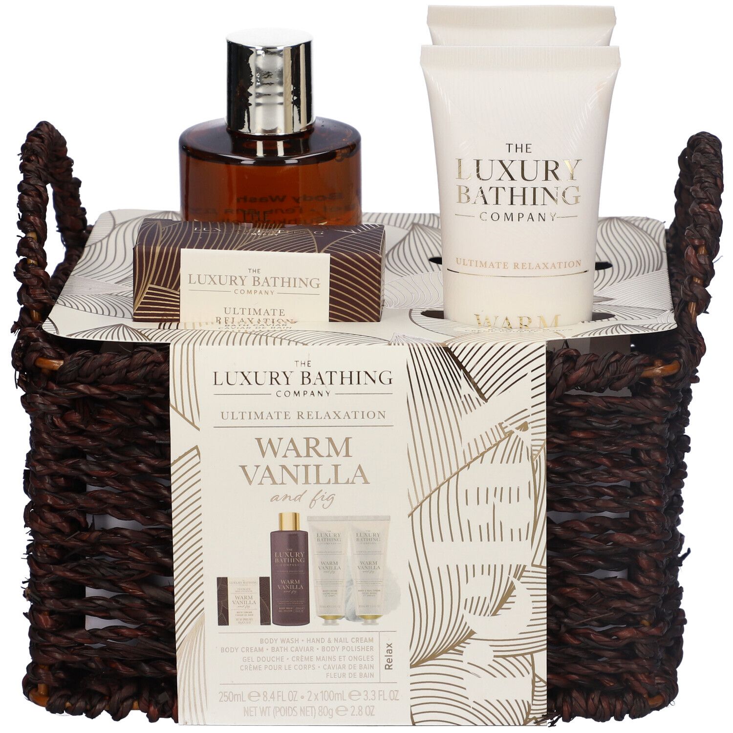 Set regalo in un cesto marrone. Contiene gel doccia, crema mani, crema corpo, perle da bagno e profumo.