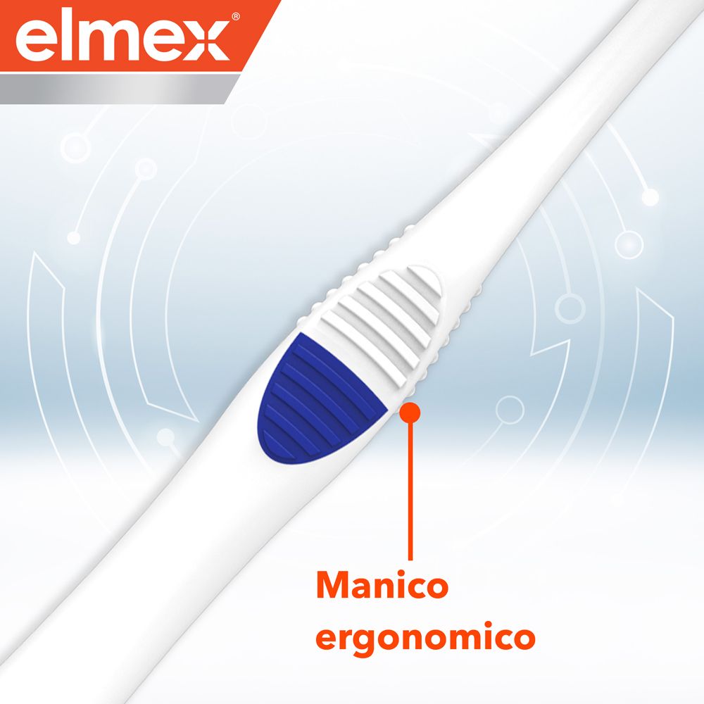 Primo piano dell'impugnatura bianca dello spazzolino Elmex. Area scanalata blu. Impugnatura ergonomica.