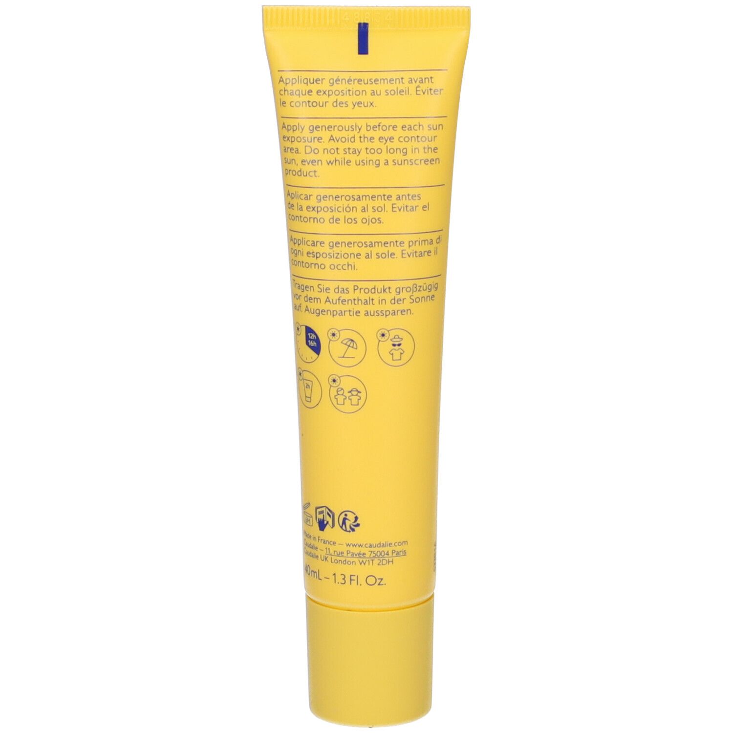 Retro del tubo giallo. Testo in più lingue. Pittogrammi con istruzioni. Scritta: Appliquer généreusement avant l'exposition au soleil.
