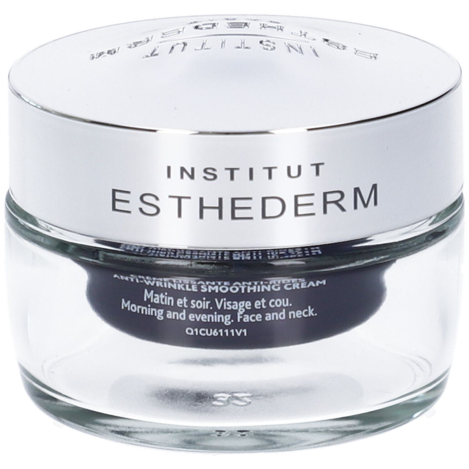 Vasetto di vetro con coperchio argentato. Scritta: INSTITUT ESTHEDERM. ANTI-WRINKLE SMOOTHING CREAM. Sfondo nero.