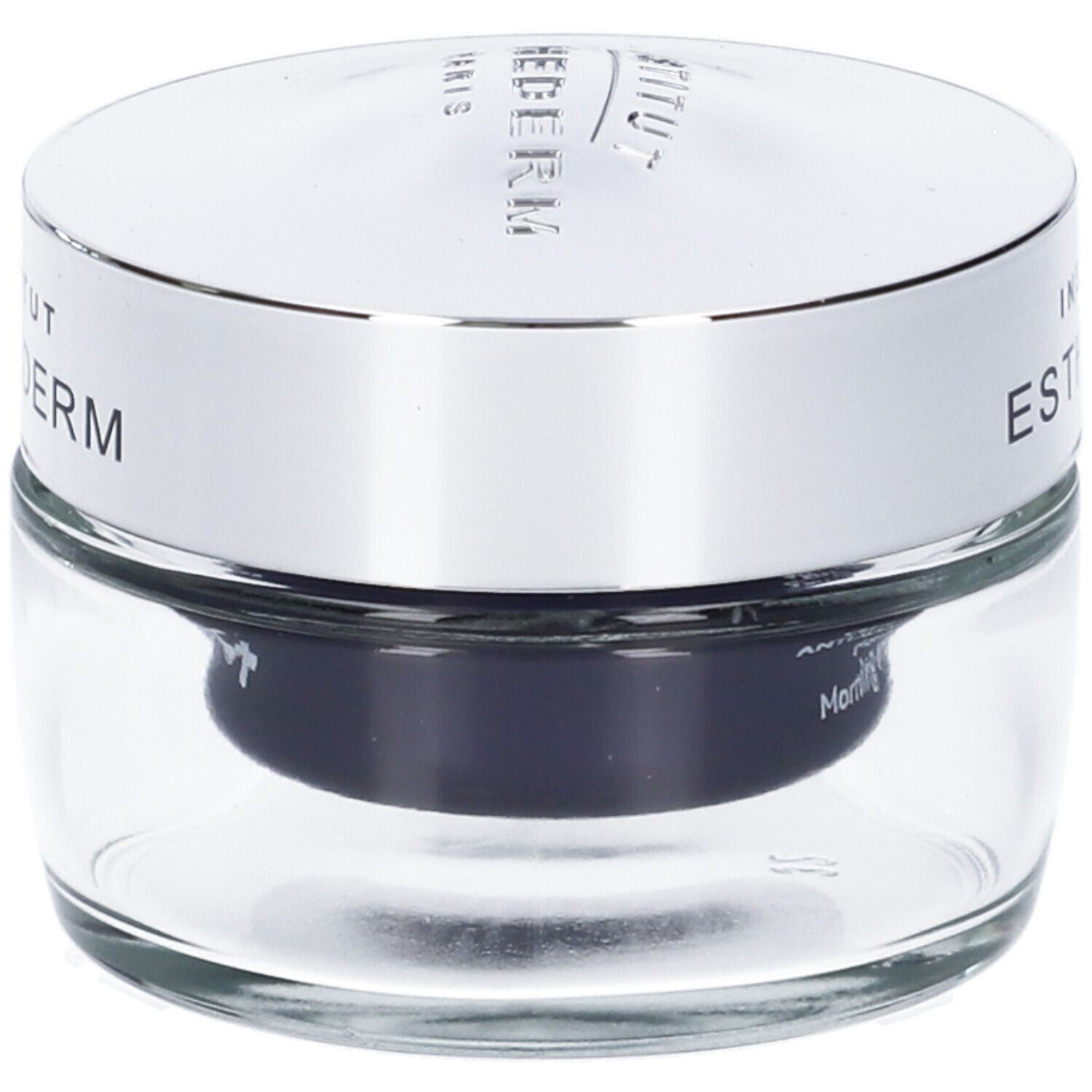 Vasetto di vetro con coperchio argentato. Scritta: INSTITUT ESTHEDERM. Sfondo nero.