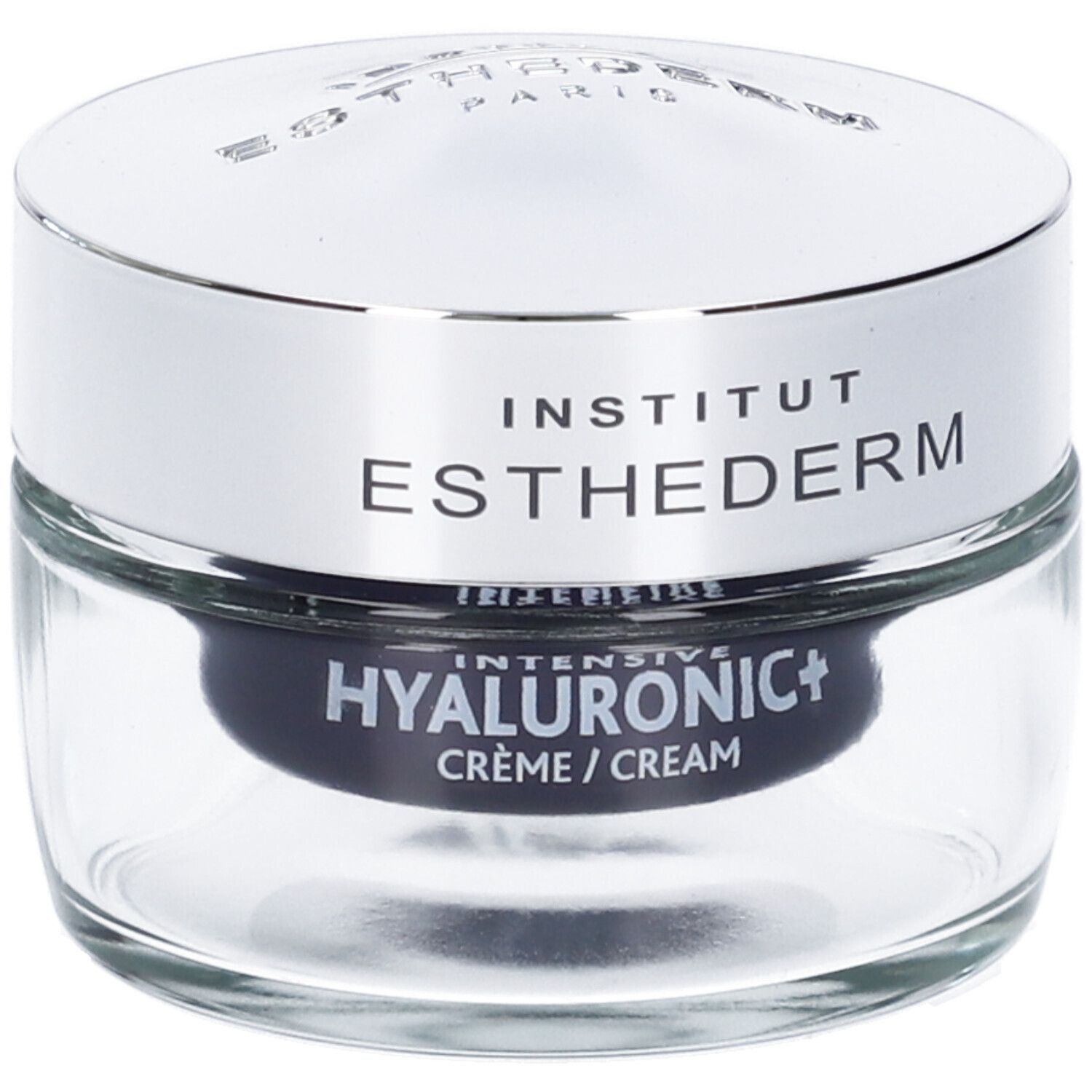 Vasetto di vetro con coperchio argentato. Scritta: INSTITUT ESTHEDERM. HYALURONIC+ CRÈME / CREAM. Sfondo nero.