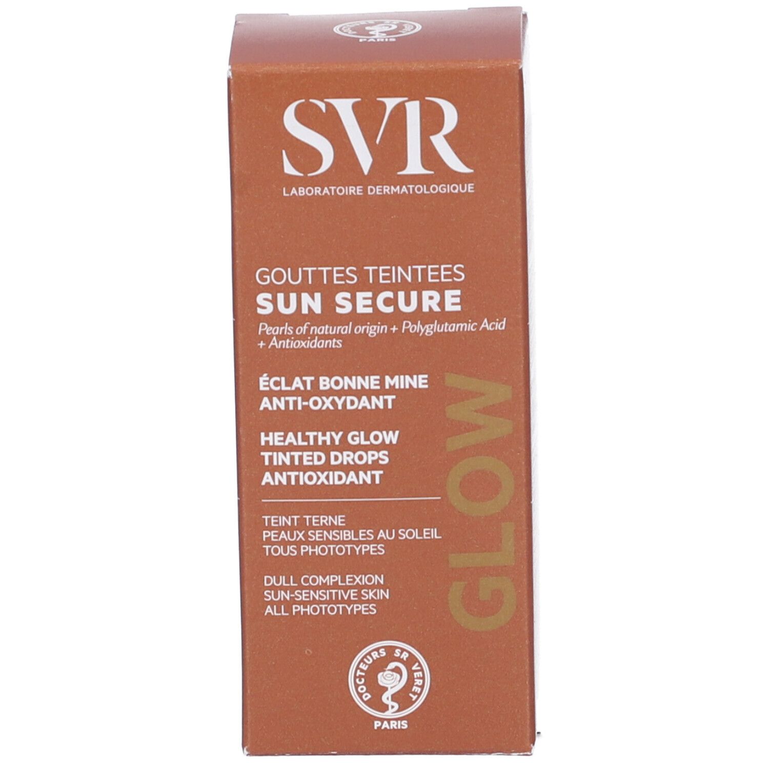 Scatola marrone. Scritte: SVR, SUN SECURE, GOUTTES TEINTEES, GLOW. Testo: ÉCLAT BONNE MINE, ANTI-OXYDANT, HEALTHY GLOW, TINTED DROPS, TEINT TERNE.