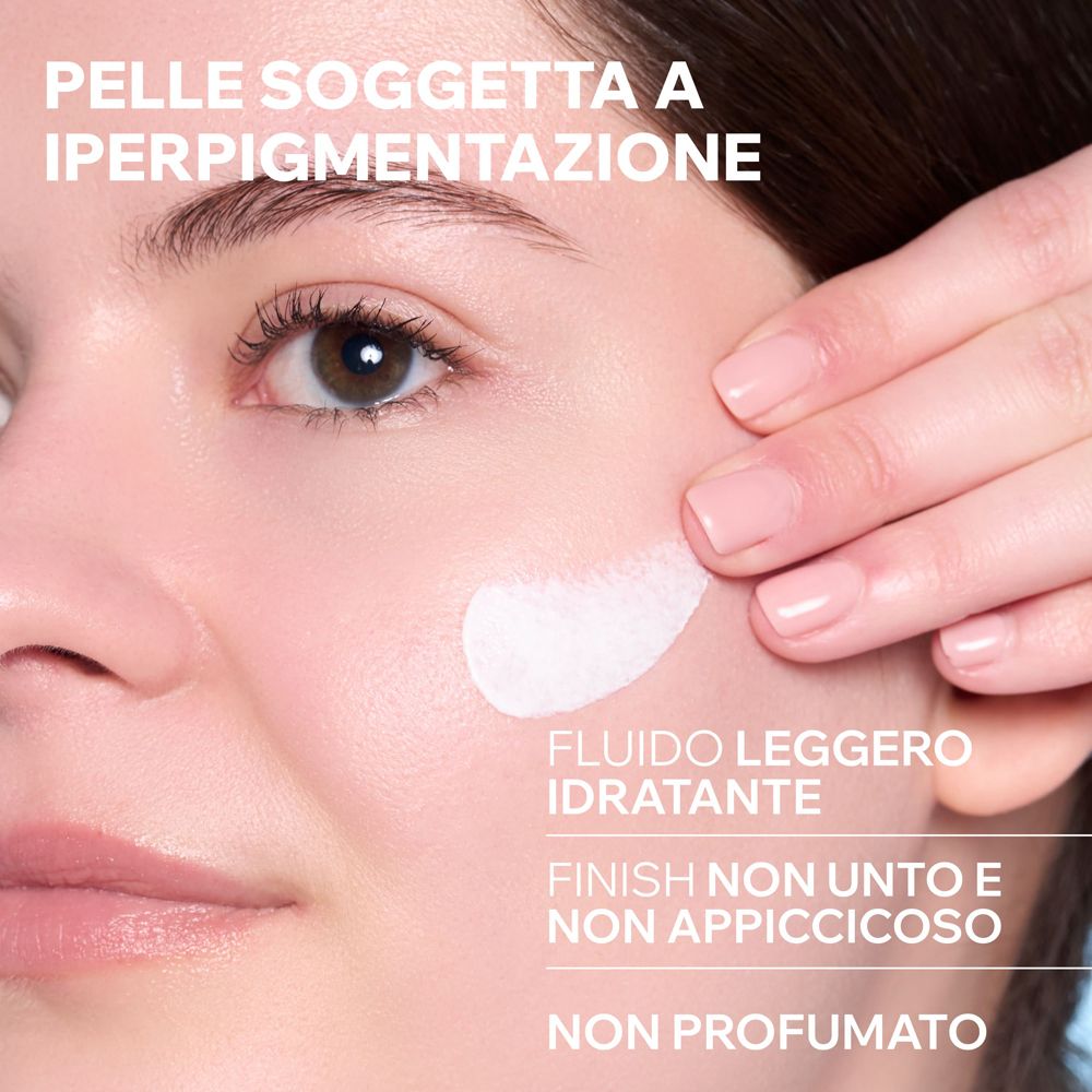 Applicazione del fluido Uriage Bariesun su pelle sensibile.