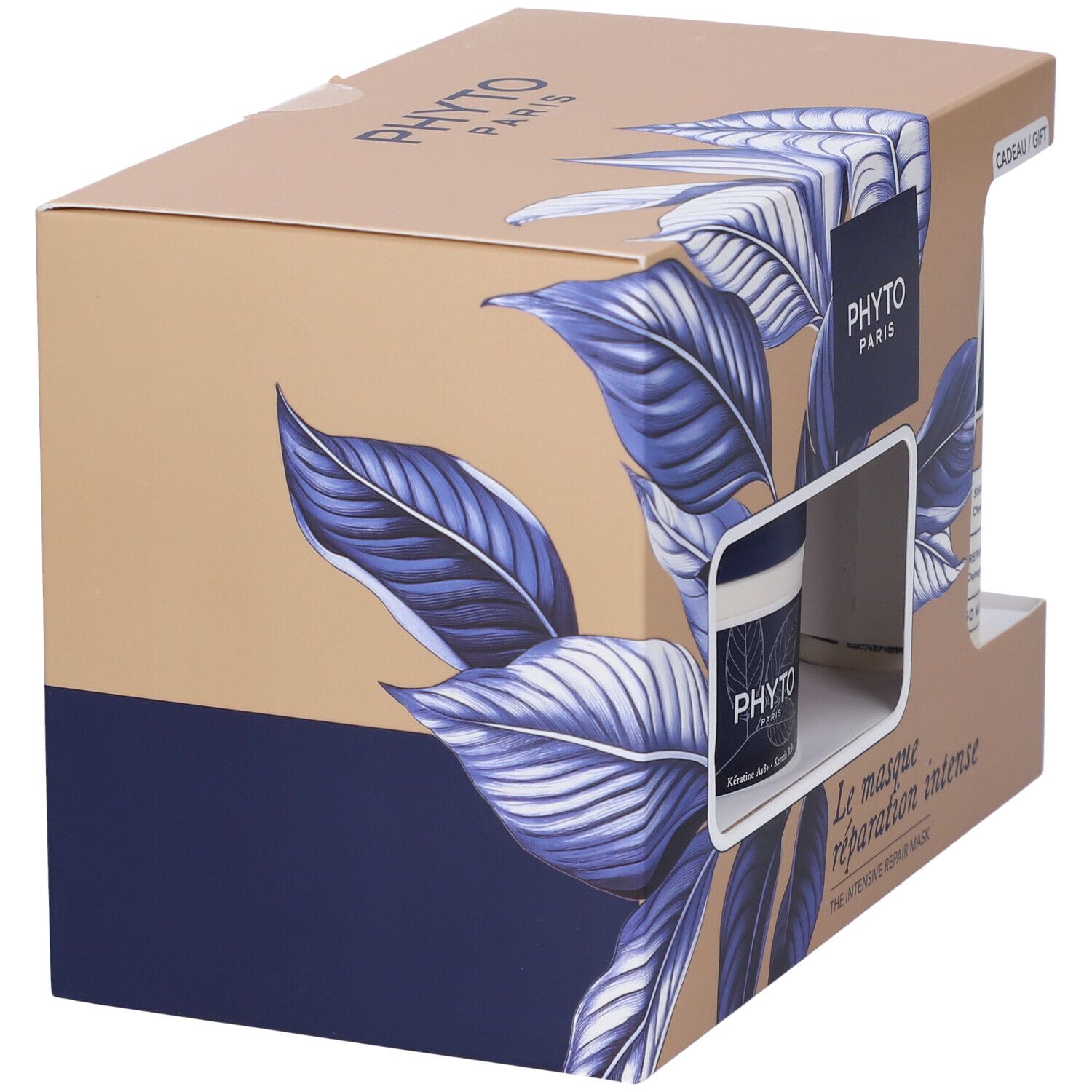 Confezione regalo con shampoo e maschera per capelli. Scatola con motivo a foglie blu e logo del marchio. Contiene due prodotti.