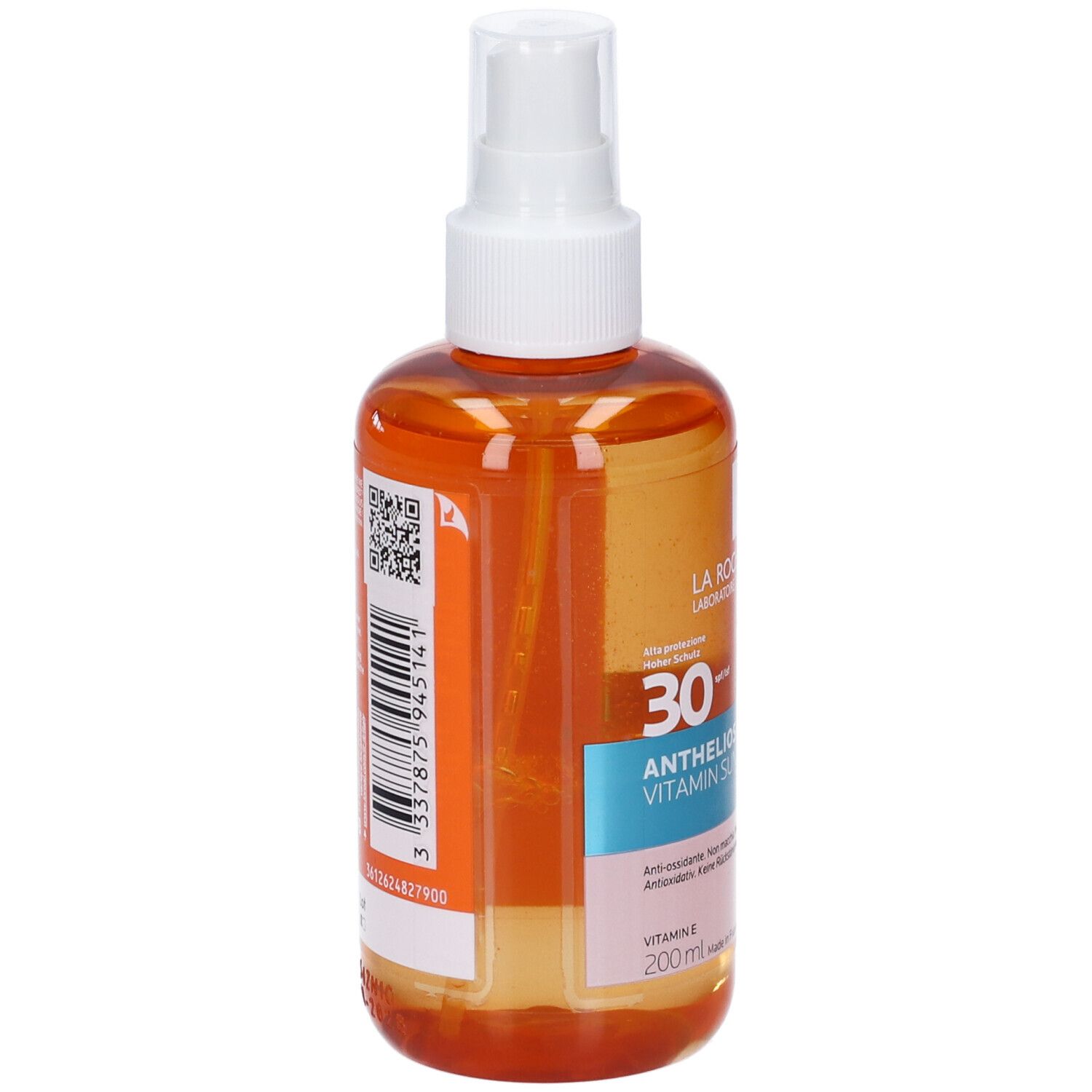 Vista posteriore di un flacone arancione con erogatore bianco. Etichetta con codice a barre e testo. Prodotto: Anthelios Vitamin Sun Mist.