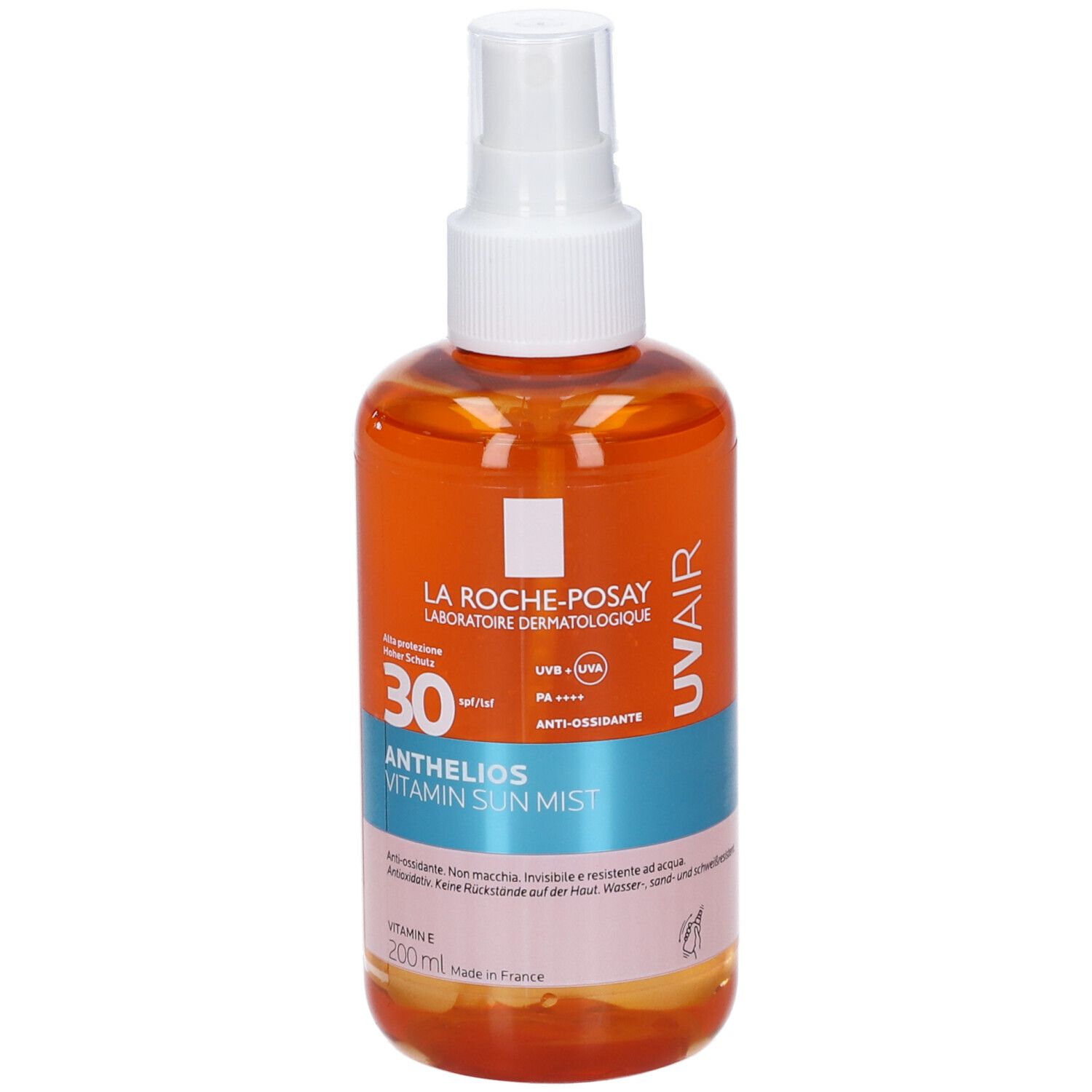 Spray di nebbia solare con erogatore bianco. Flacone arancione con etichetta blu e rosa. Testo: Anthelios Vitamin Sun Mist SPF 30.