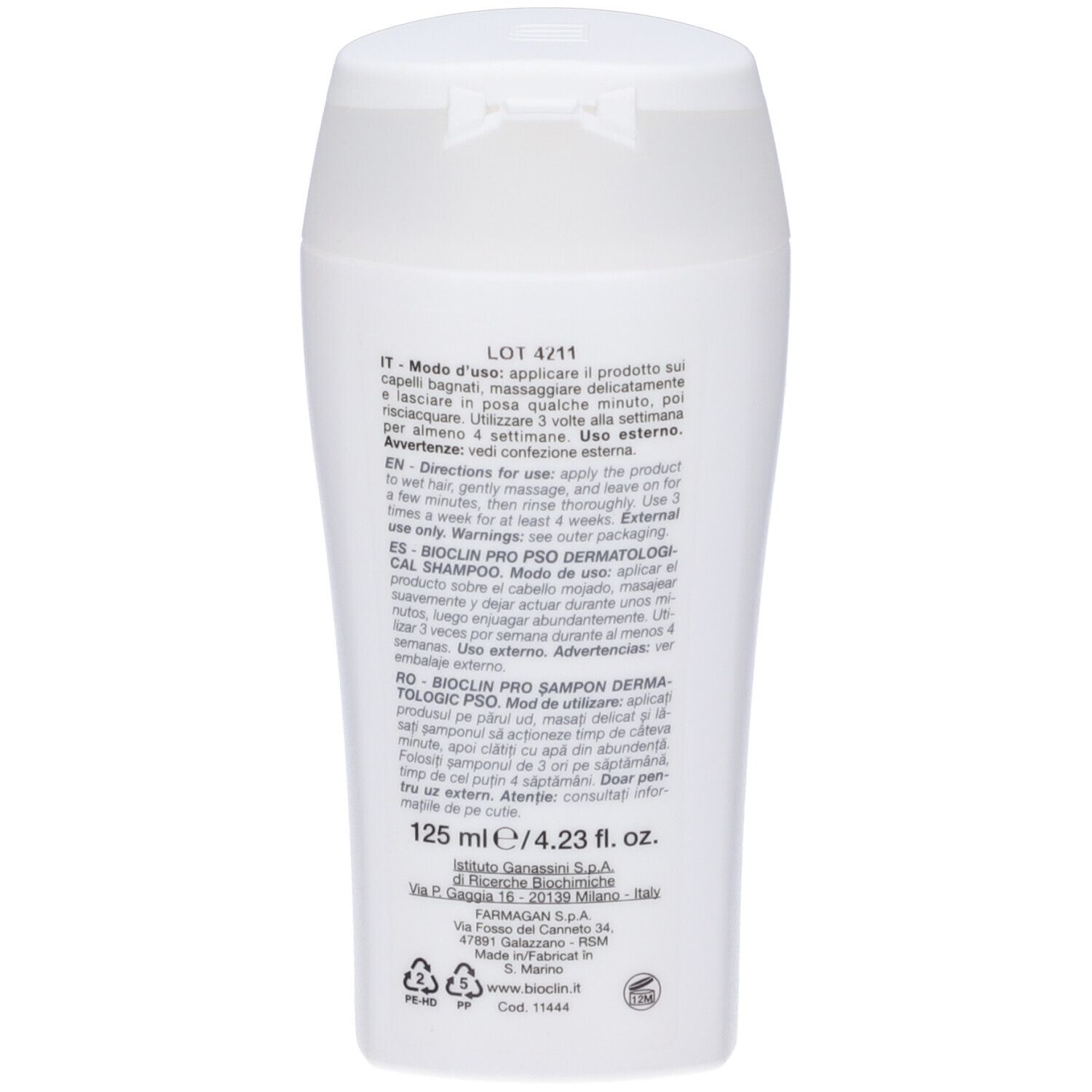 Retro del flacone di shampoo bianco. Testo multilingue. Contiene informazioni per l'uso e avvertenze.