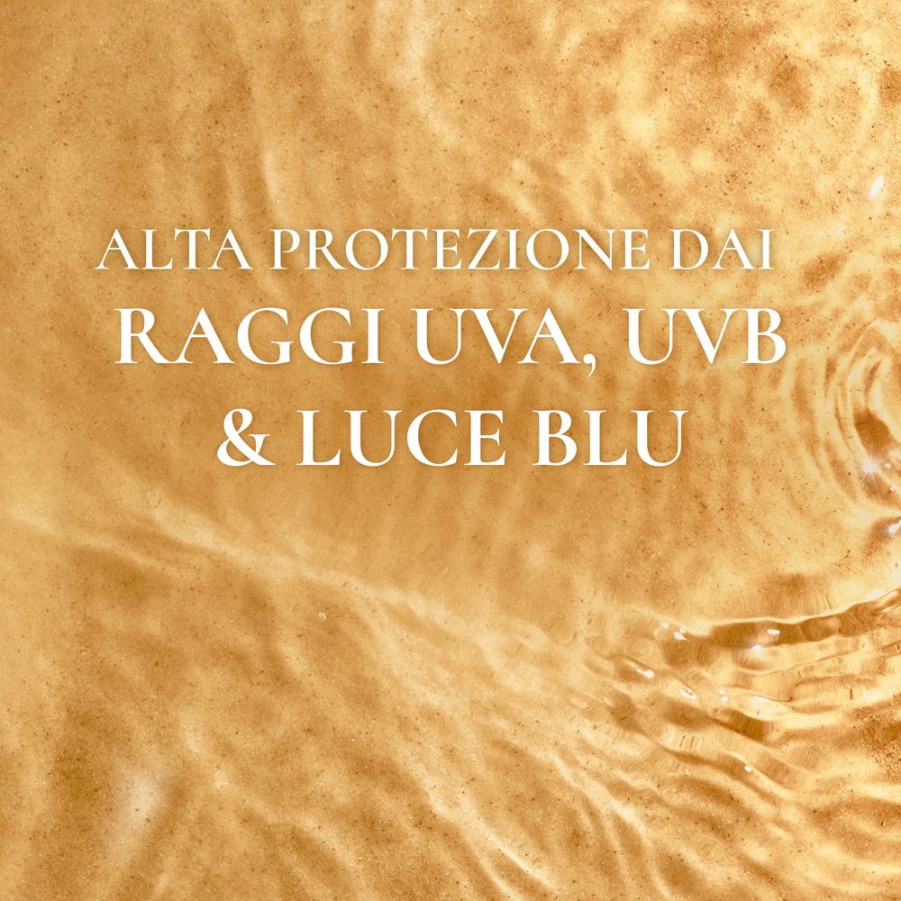 Testo su sfondo dorato: ALTA PROTEZIONE DAI RAGGI UVA, UVB & LUCE BLU.