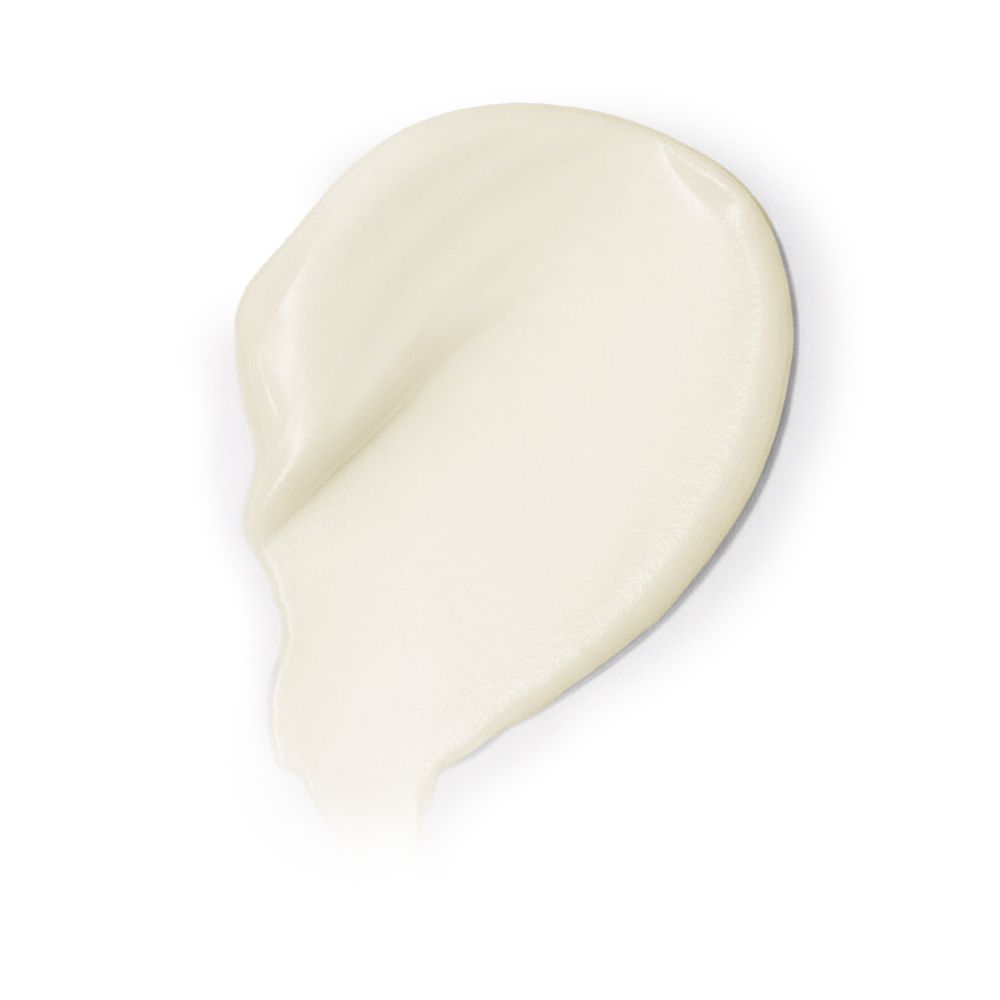 Striscio di balsamo. Color crema. Sfondo bianco.