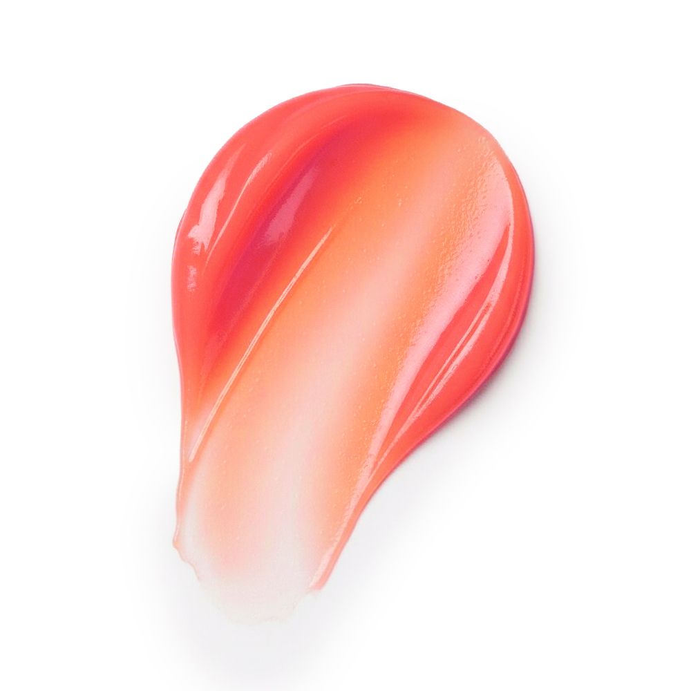 Macchia di balsamo rosso su sfondo bianco. Forma ovale, lucida.