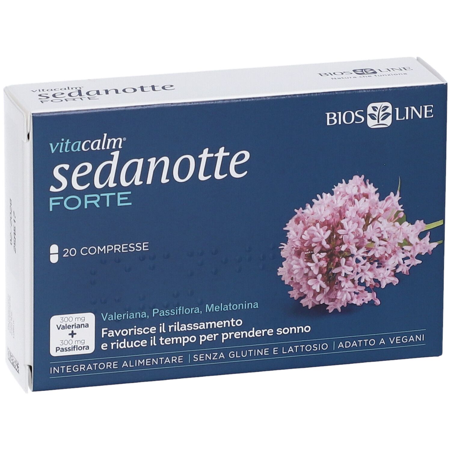 Scatola blu e bianca con nome del prodotto e immagine floreale. Contiene 20 compresse. Testo: 'Vitacalm Sedanotte Forte'.