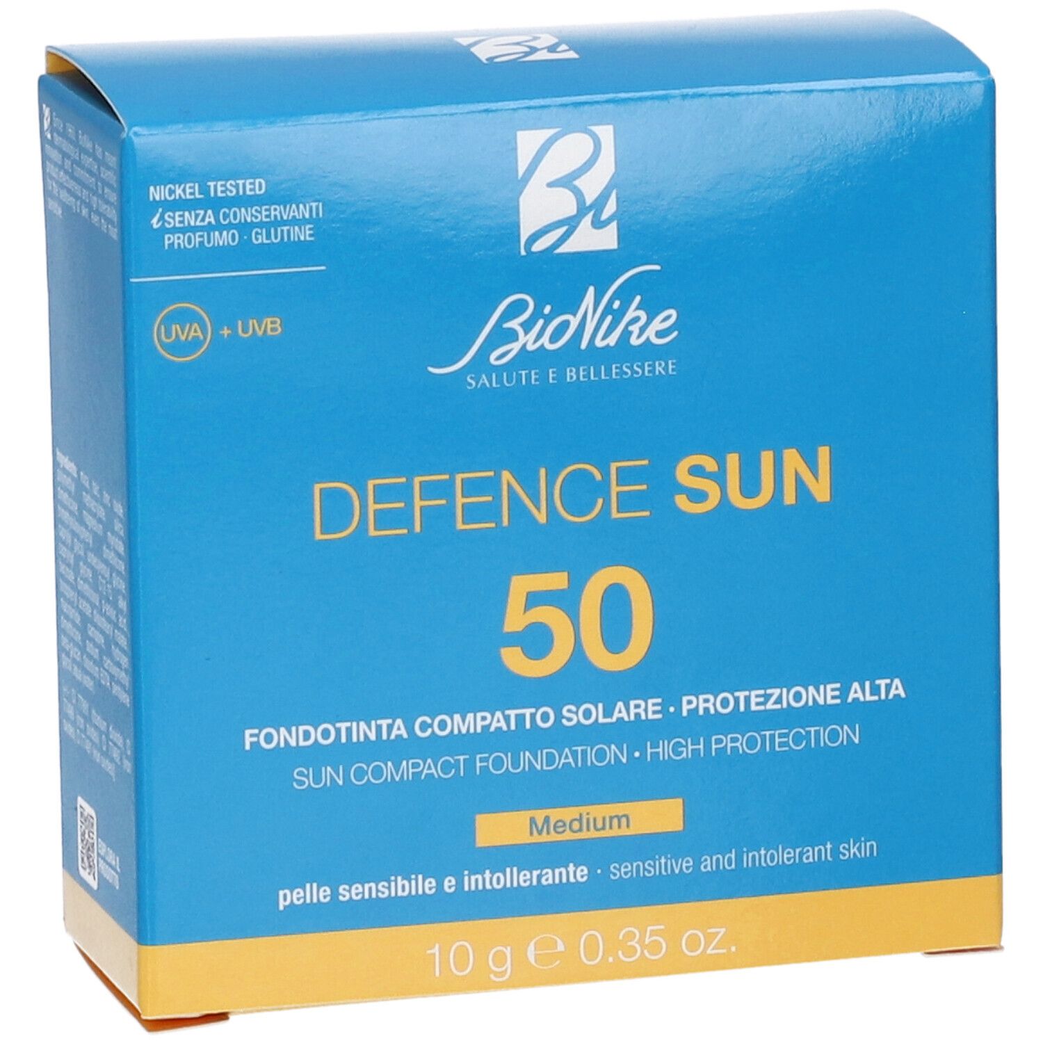 Scatola blu Bionike con 'DEFENCE SUN 50'. Contiene fondotinta compatto solare, alta protezione, tonalità Medium. 10g.