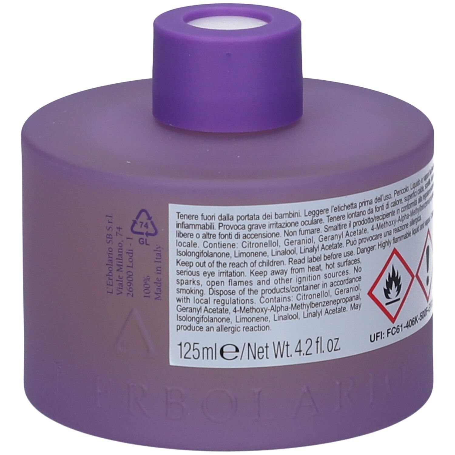 Contenitore viola con tappo viola. Etichetta con simboli di avvertimento e testo. Ingredienti e avvertenze.