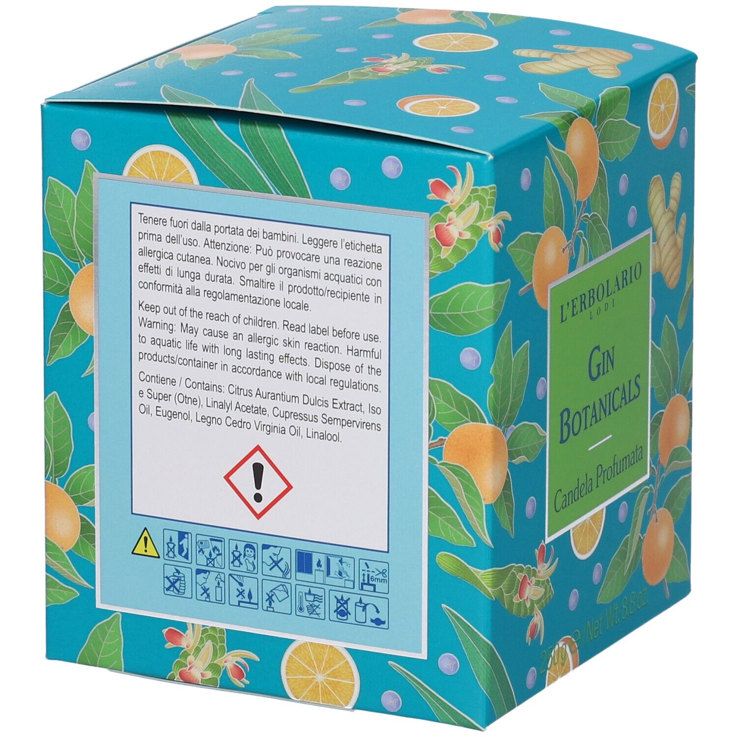 Scatola turchese con motivi di arance e zenzero. Testo: Attenzione, contiene ingredienti. Marchio: L'Erbolario.