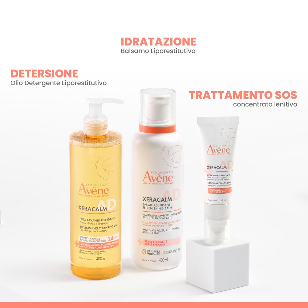 Flacone di balsamo Avene Xeracalm AD accanto a olio detergente e concentrato SOS.