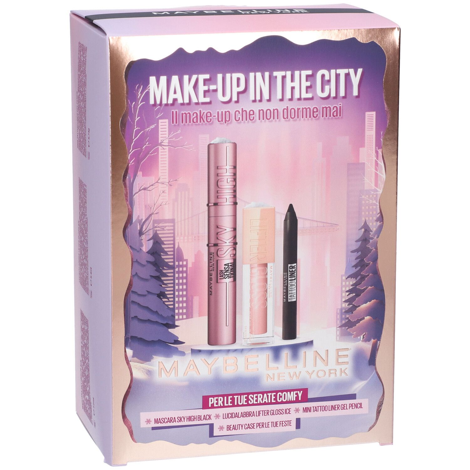 Confezione regalo rosa Maybelline New York. Contiene mascara, gloss e eyeliner nero. Testo: Make-up in the City. Scritta: Per le tue serate comfy.