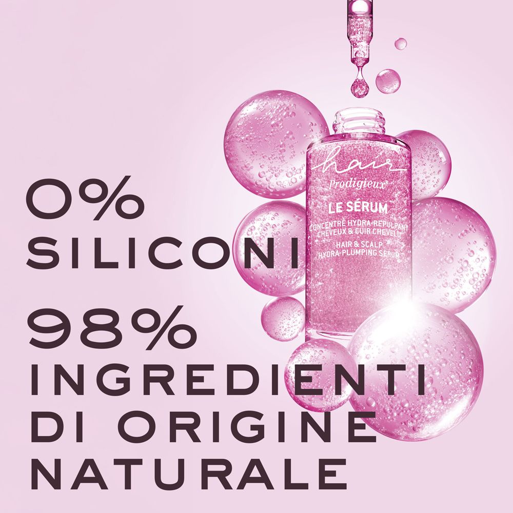 Flacone in vetro rosa, circondato da bolle rosa. Testo: 0% SILICONI, 98% INGREDIENTI DI ORIGINE NATURALE.