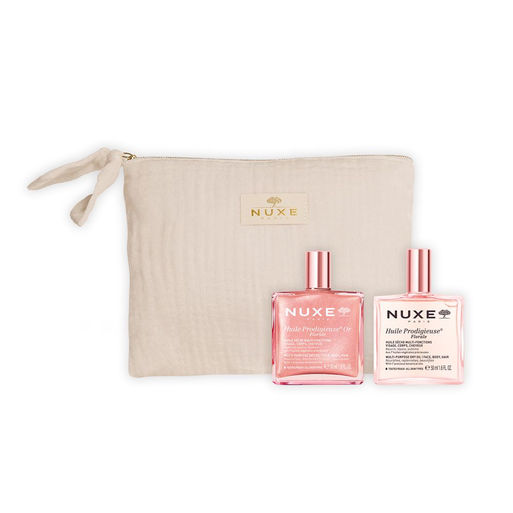 Pochette beige con due flaconi. Scritta: Nuxe. Due flaconi con liquido rosa.