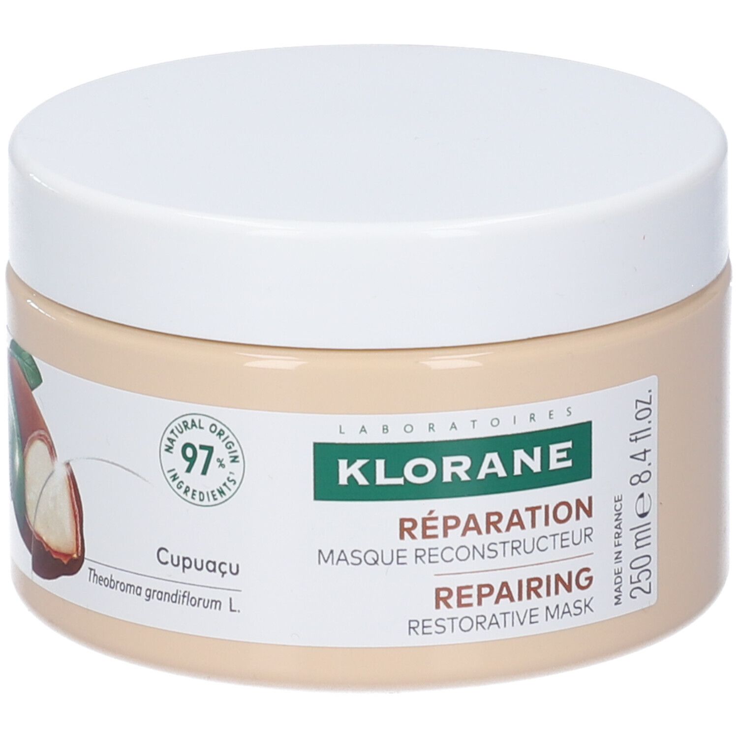 Vaso beige con coperchio bianco. Logo Klorane e nome del prodotto. 250 ml. 97% ingredienti naturali. Illustrazione di cupuaçu.