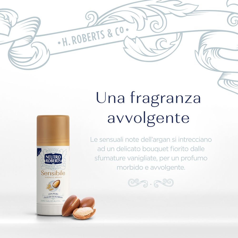 Immagine pubblicitaria con stick e noci di argan. Testo: Una fragranza avvolgente. Descrizione della fragranza.
