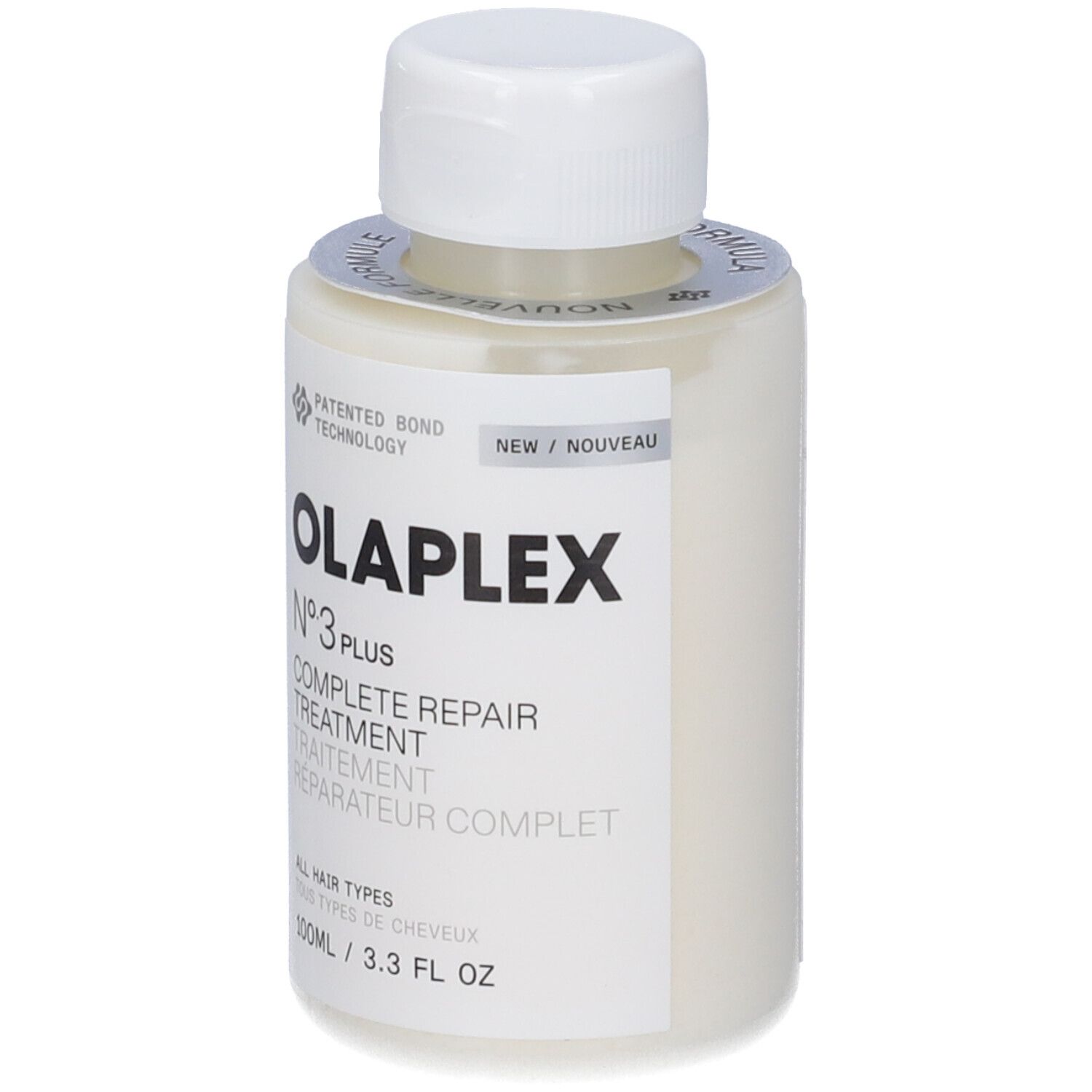 Flacone beige con tappo bianco. Scritta: OLAPLEX N°3 PLUS COMPLETE REPAIR TREATMENT. Etichetta con testo e logo.
