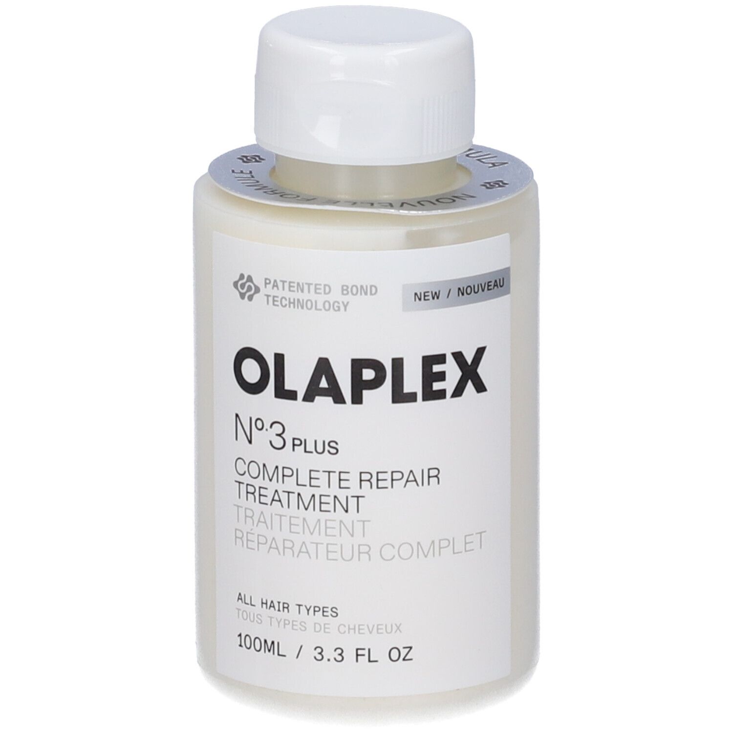 Flacone beige con tappo bianco. Scritta: OLAPLEX N°3 PLUS COMPLETE REPAIR TREATMENT. Etichetta con testo e logo.