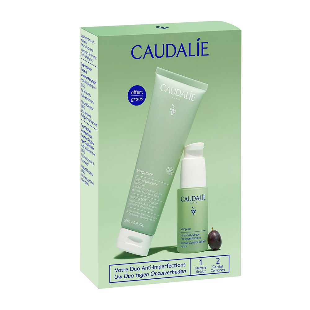 Duo di prodotti Caudalie in scatola verde. Detergente in gel e siero. Logo dell'uva e testo. Adesivo « Offerta gratuita ». Uva nera.