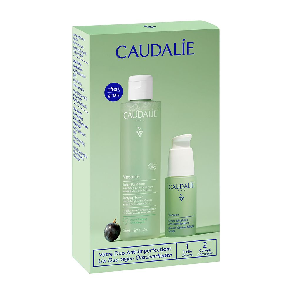 Confezione regalo con due prodotti. Una bottiglia verde e una bottiglia piccola con tappo bianco. Scritta: Caudalie. Sulla confezione è raffigurata un'uva.