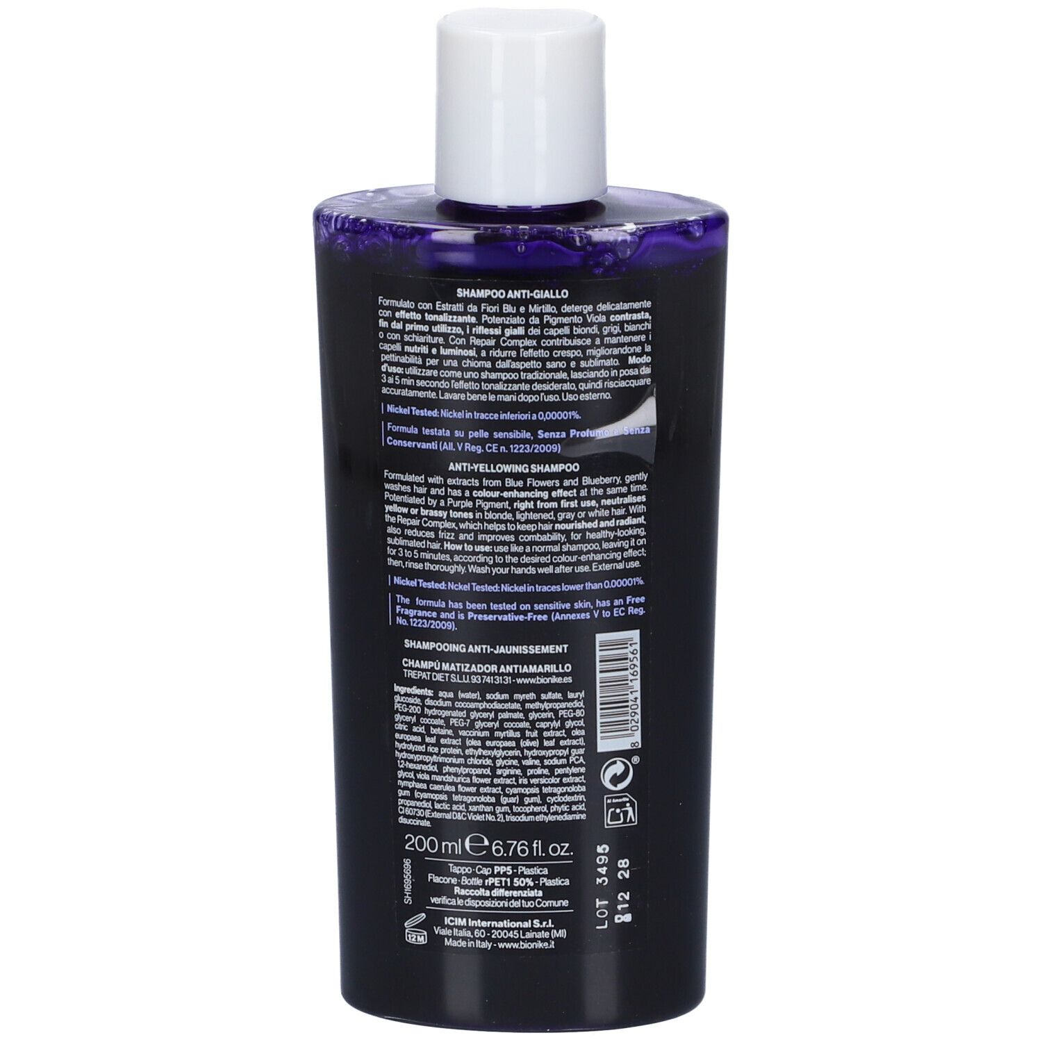 Retro del flacone di shampoo. Testo multilingue. Contiene informazioni sul prodotto e sugli ingredienti.