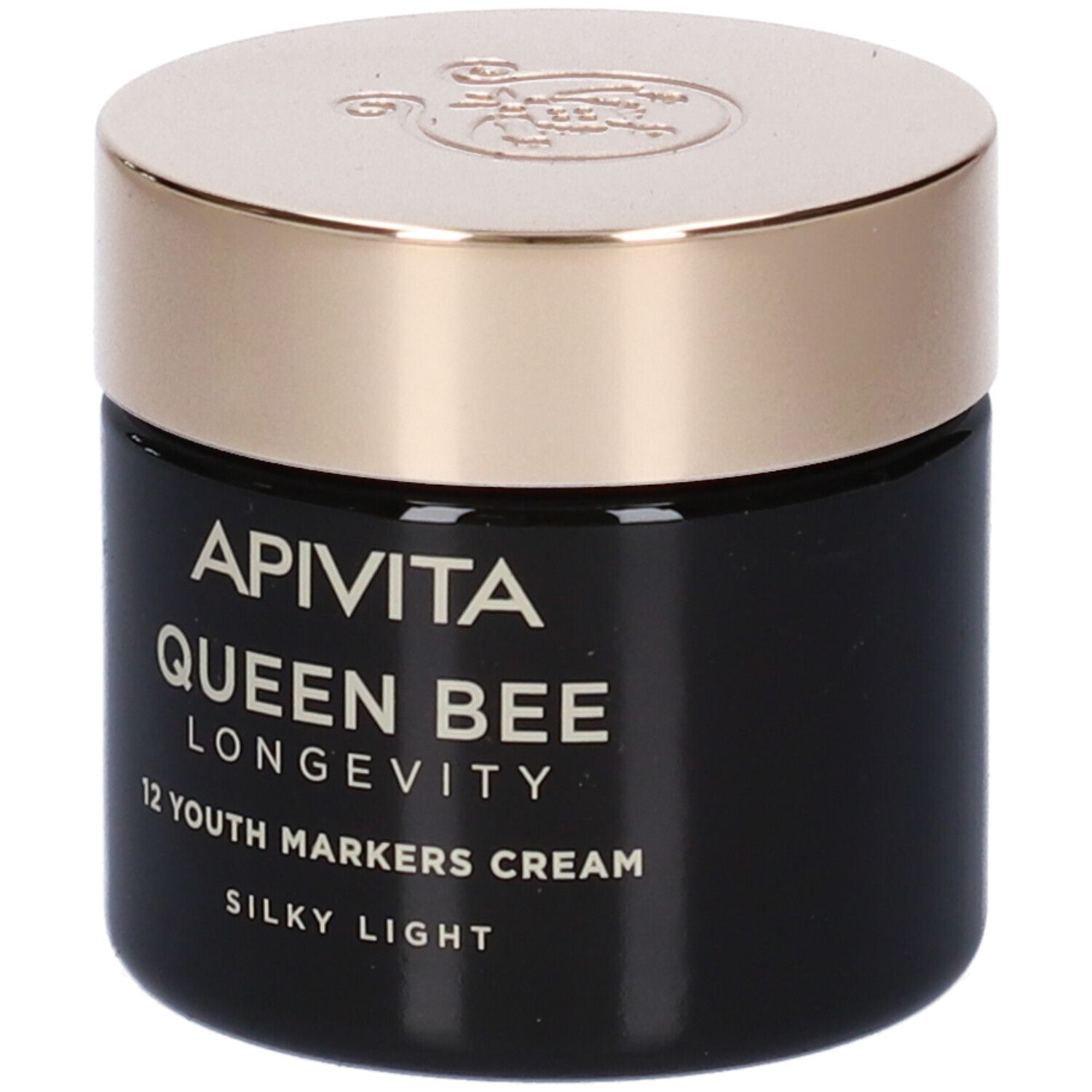 Vasetto di crema nero con coperchio dorato. Scritta: Apivita Queen Bee Longevity 12 Youth Markers Cream Silky Light.