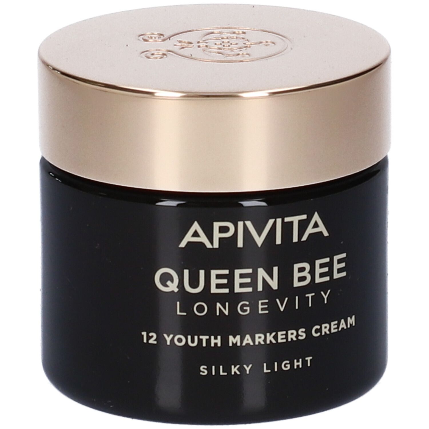 Vasetto di crema nero con coperchio dorato. Scritta: Apivita Queen Bee Longevity 12 Youth Markers Cream Silky Light.