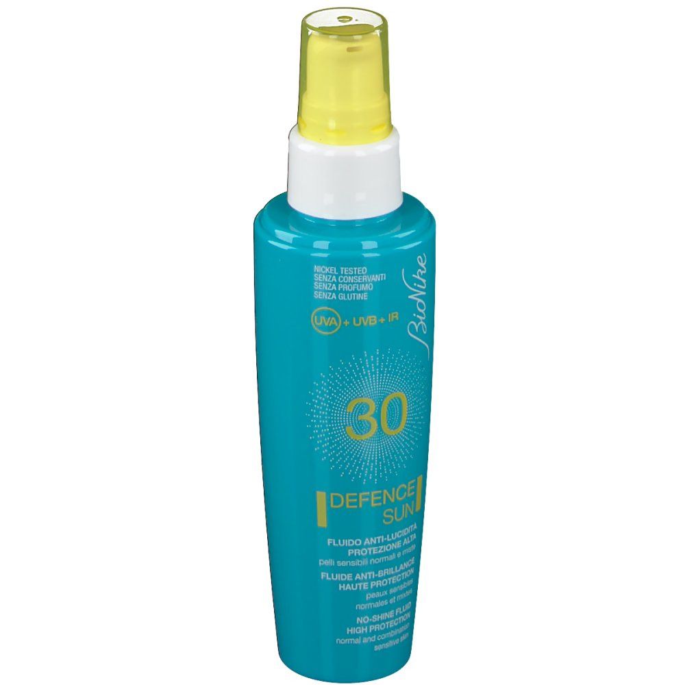 Flacone turchese con erogatore giallo. Scritta: 30, Defence Sun, Bionike. Per pelli sensibili.