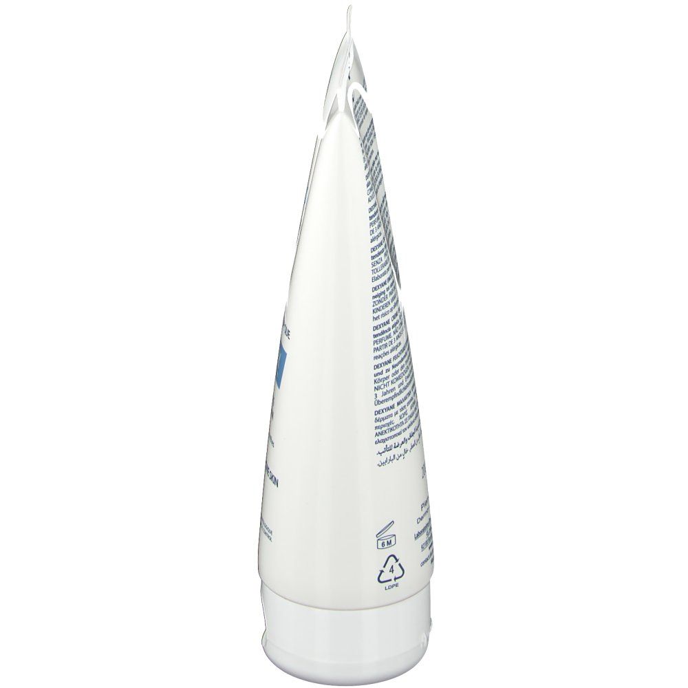 Vista laterale di un tubo bianco. Contiene testo. Stampe e simboli. Tappo e tubo sono bianchi.