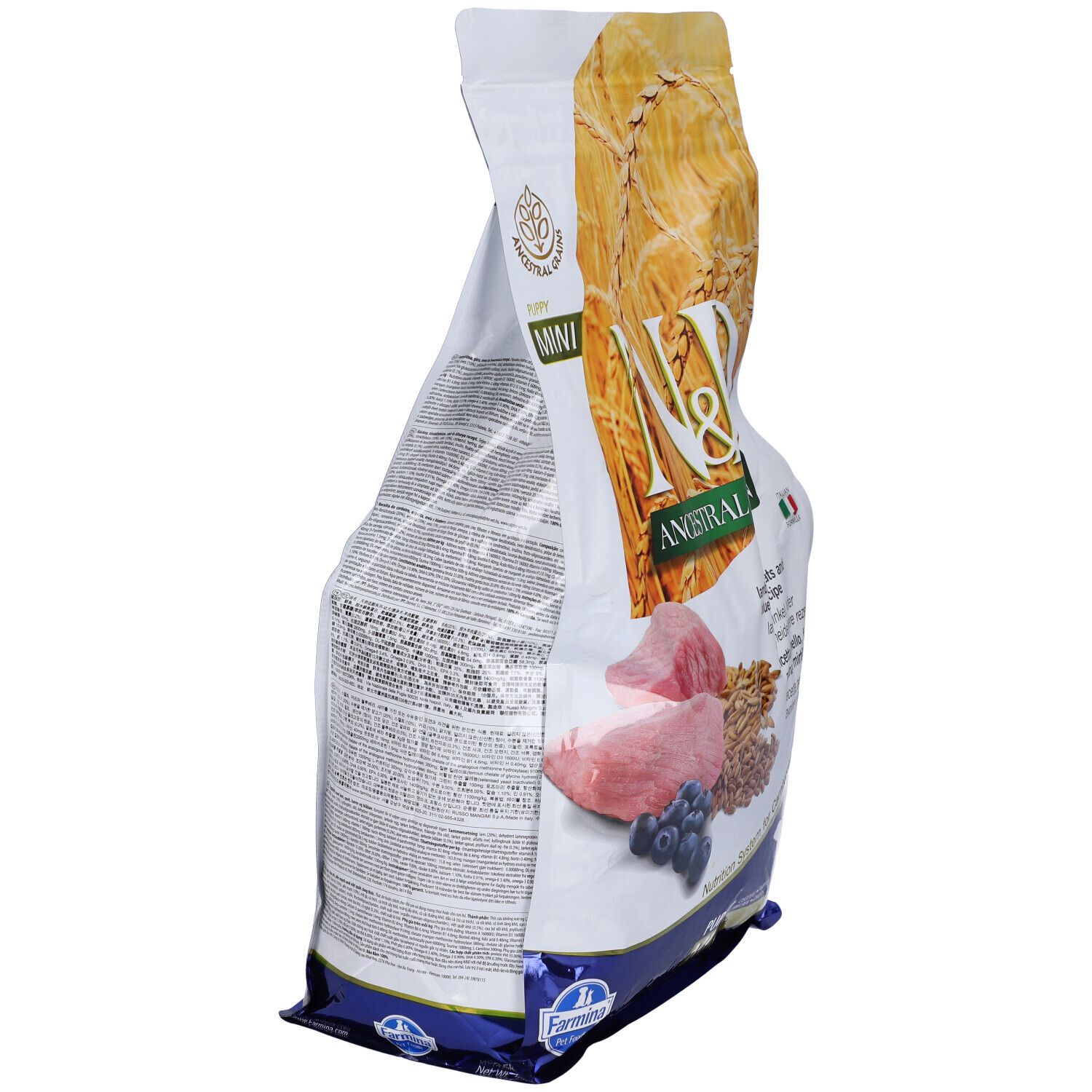 Confezione di cibo secco, vista laterale. Scritta: N&D Ancestral Grain. Immagine di agnello, mirtilli e cereali.