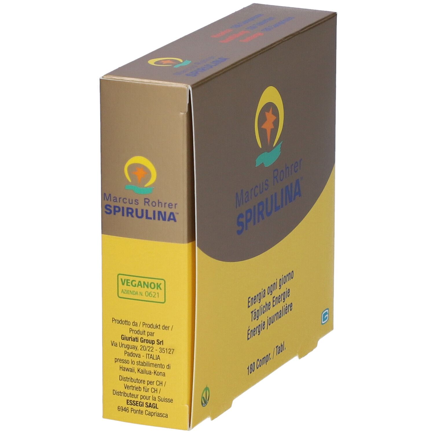 Scatola marrone e gialla. Scritta: Marcus Rohrer Spirulina. Contiene 180 compresse. Logo vegano. Vista laterale.