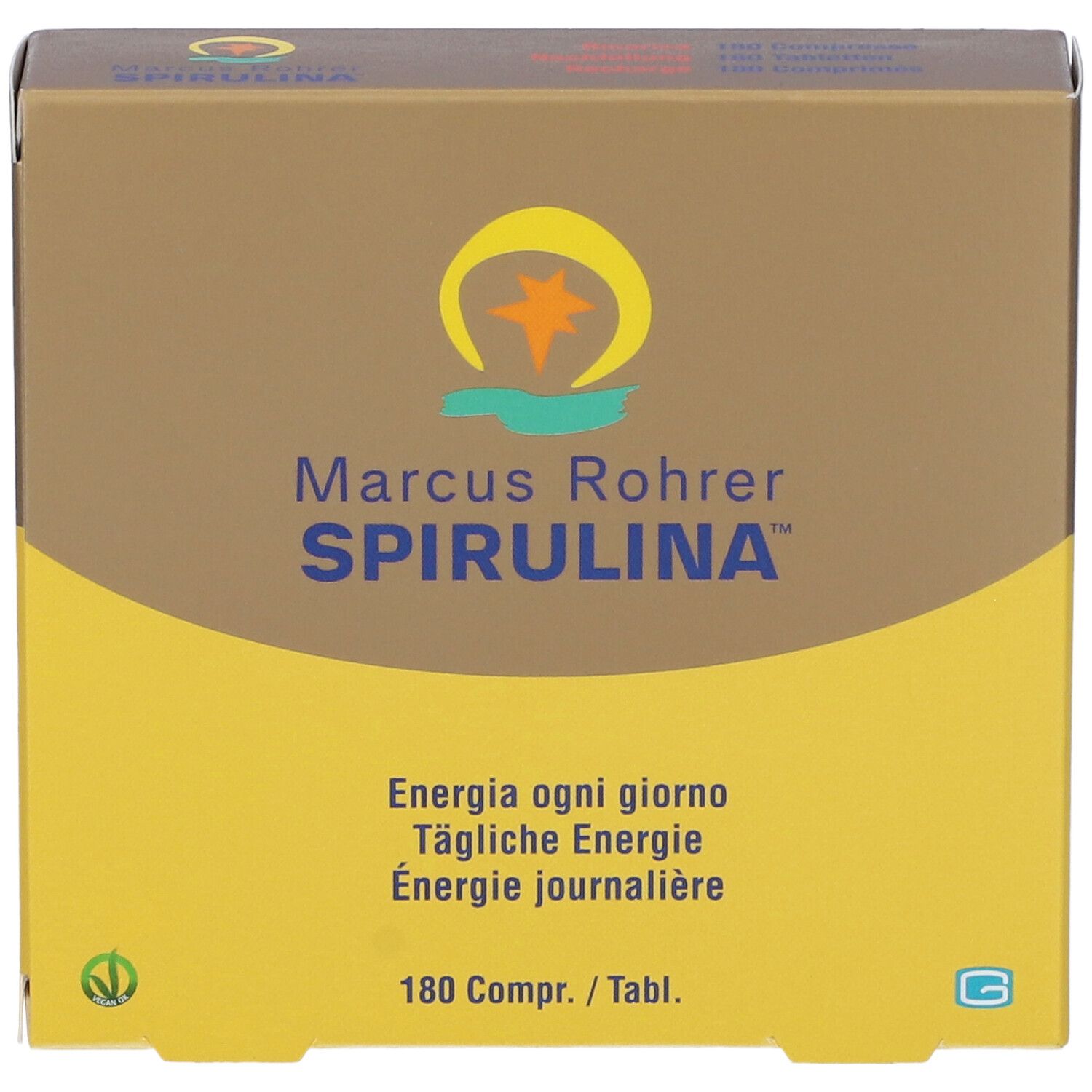 Scatola marrone e gialla. Scritta: Marcus Rohrer Spirulina. Contiene 180 compresse. Logo vegano. Vista dall'alto.