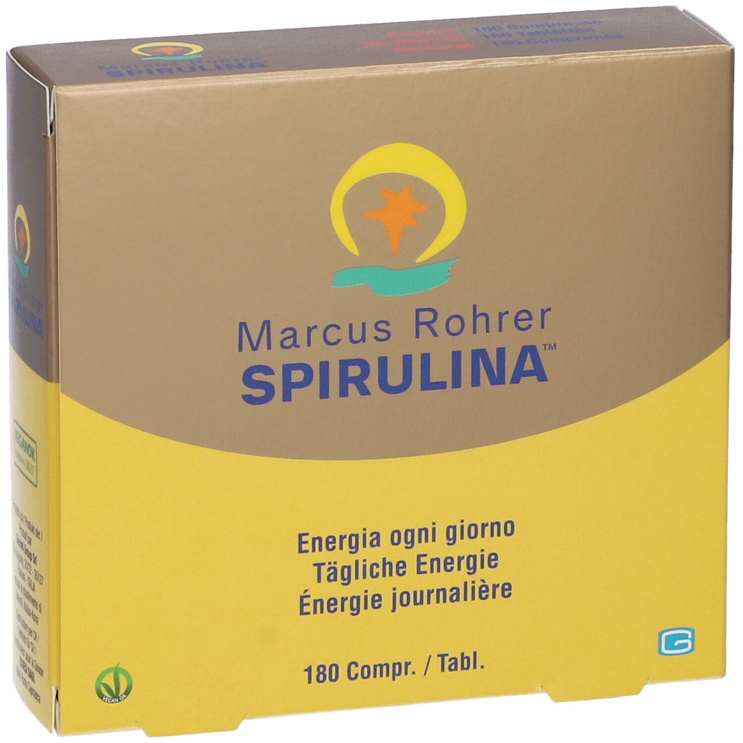 Scatola marrone e gialla. Scritta: Marcus Rohrer Spirulina. Contiene 180 compresse. Logo vegano. Vista dall'alto.