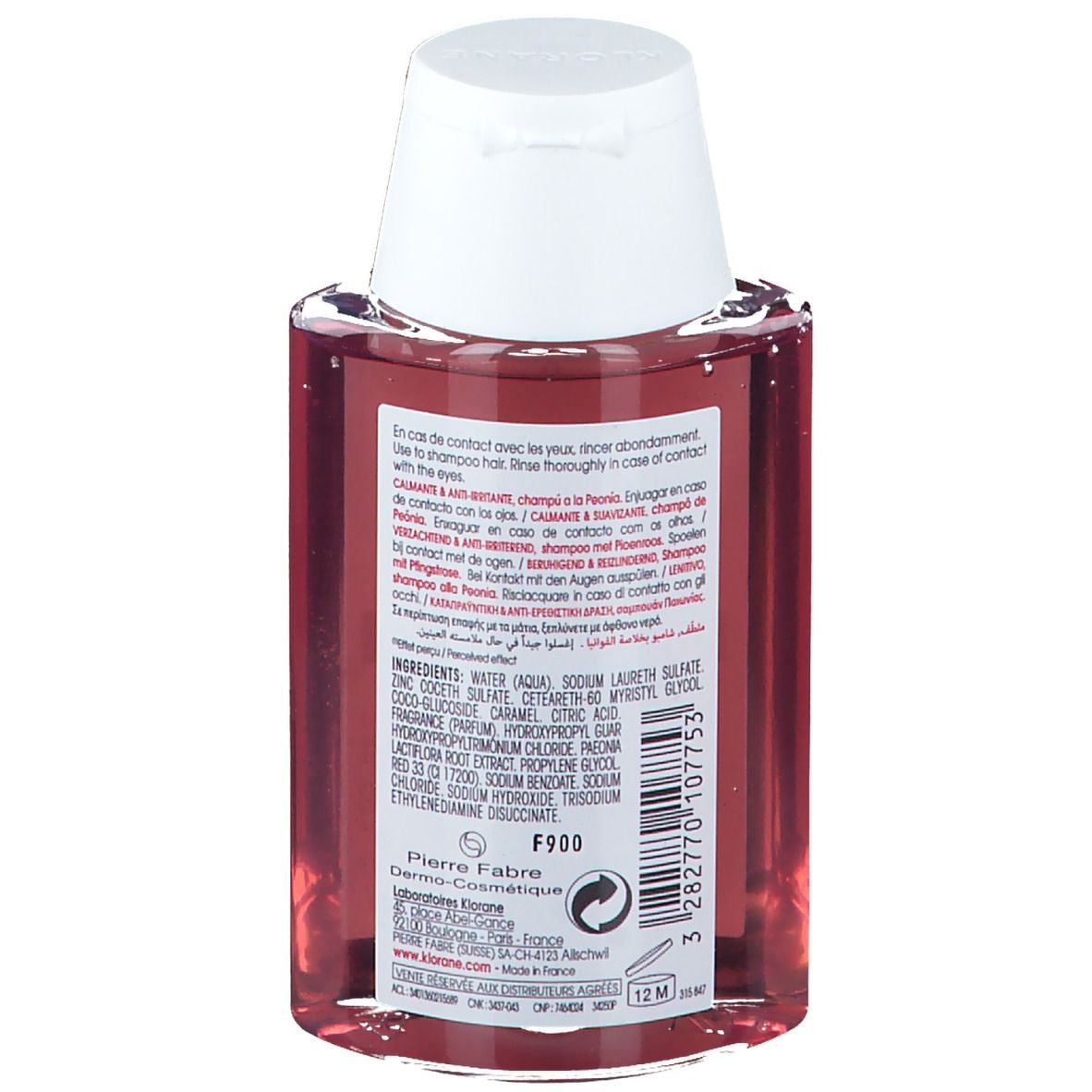 Retro del flacone di shampoo KLORANE. Contiene ingredienti, avvertenze e informazioni del produttore. Tappo bianco.