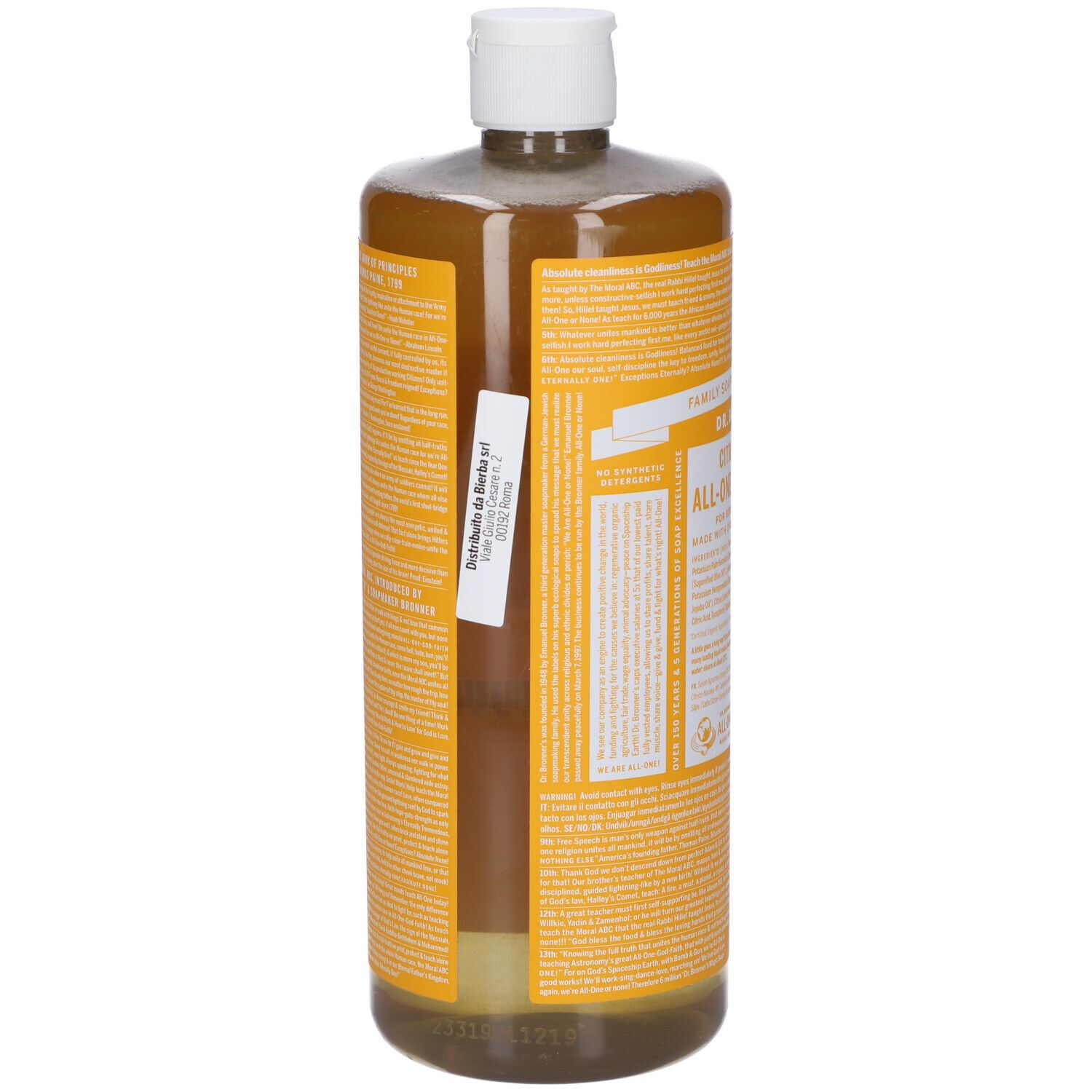 Flacone con etichetta gialla. Adesivo con testo. Tappo bianco. Liquido trasparente visibile. Vista posteriore.