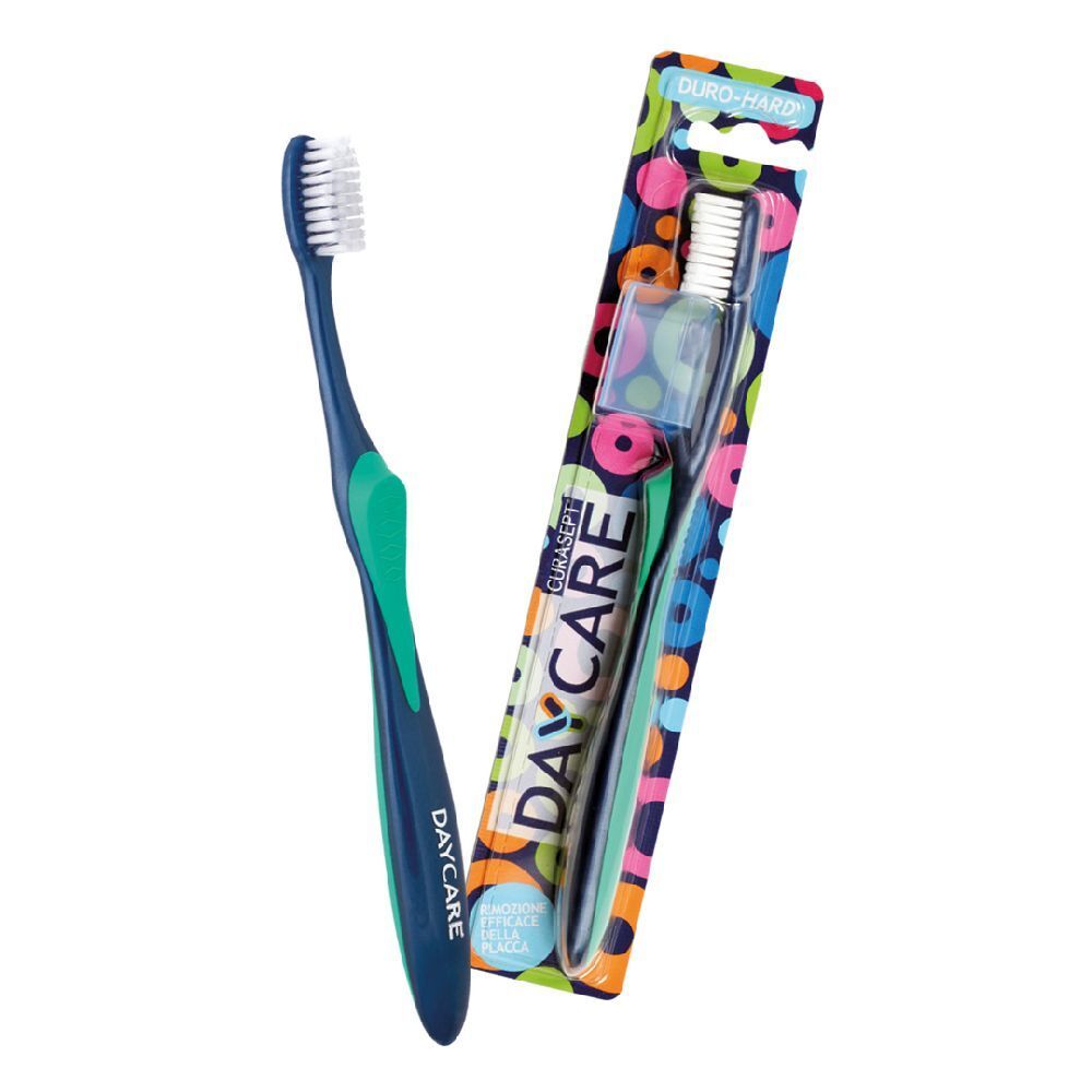 Spazzolino blu e verde, confezionato in blister con nome del prodotto e marchio.
