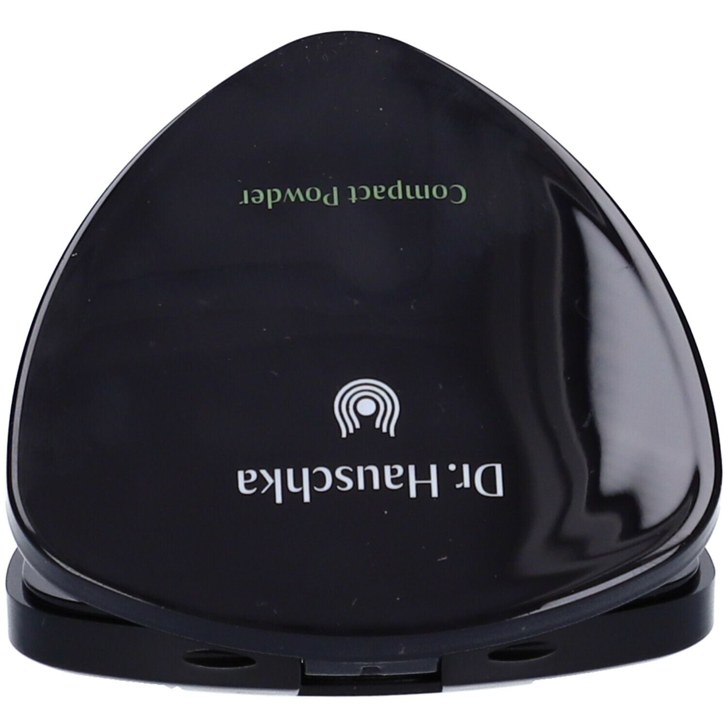 Cipria compatta nera chiusa. Sul coperchio: Dr. Hauschka, Compact Powder.