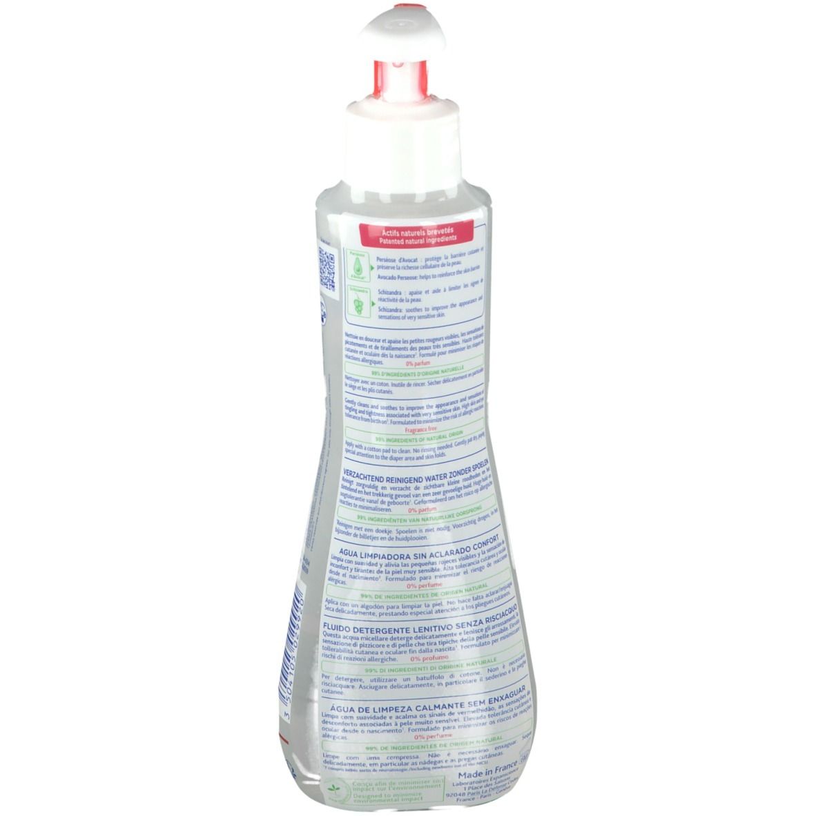 Retro di un flacone trasparente con informazioni sul prodotto in diverse lingue.