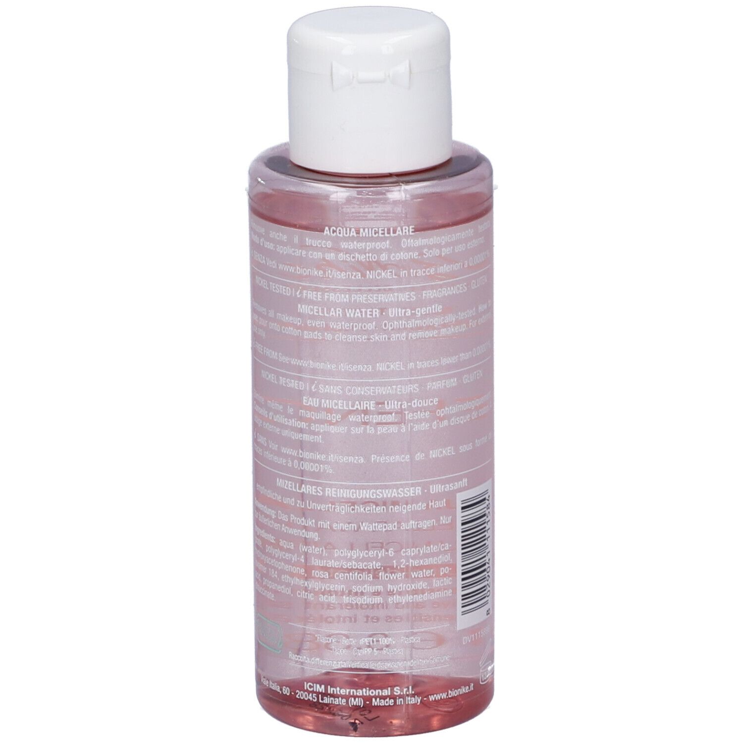 Retro del flacone. Testo multilingue. Flacone con liquido rosa. Tappo bianco.