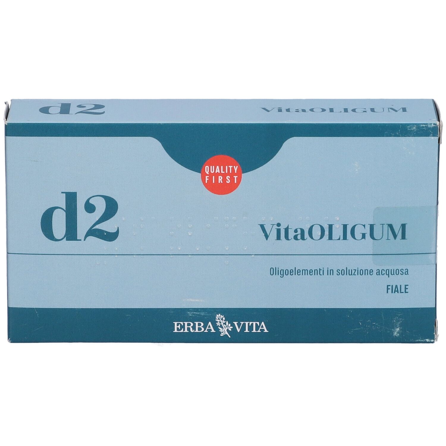 Scatola blu e bianca con "d2" e "VitaOLIGUM". Logo "Quality First". Logo "Erba Vita".
