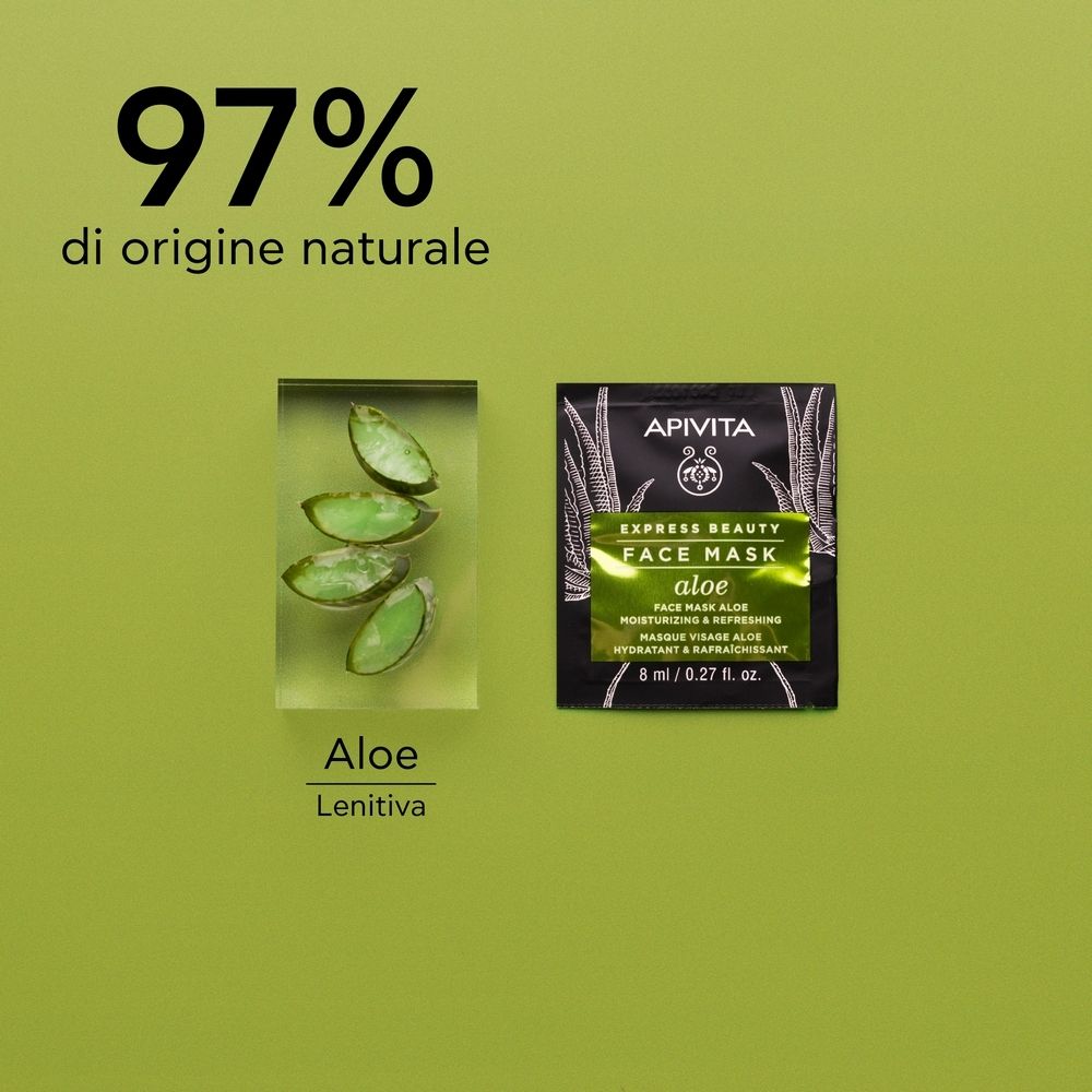 Confezione di maschera viso accanto a foglie di aloe vera in un blocco. 97% di origine naturale.