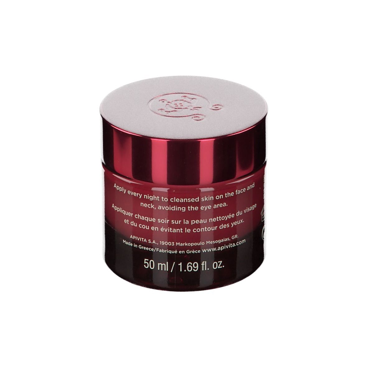 Vaso di crema bordeaux con coperchio bianco. Scritta: APIVITA WINE ELIXIR. Testo e volume.