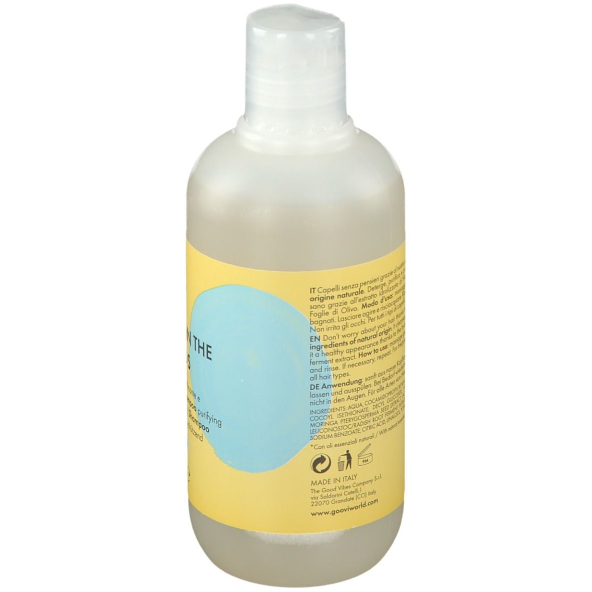 Retro della bottiglia di shampoo Goovi. Etichetta gialla con testo e ingredienti. Liquido trasparente visibile.